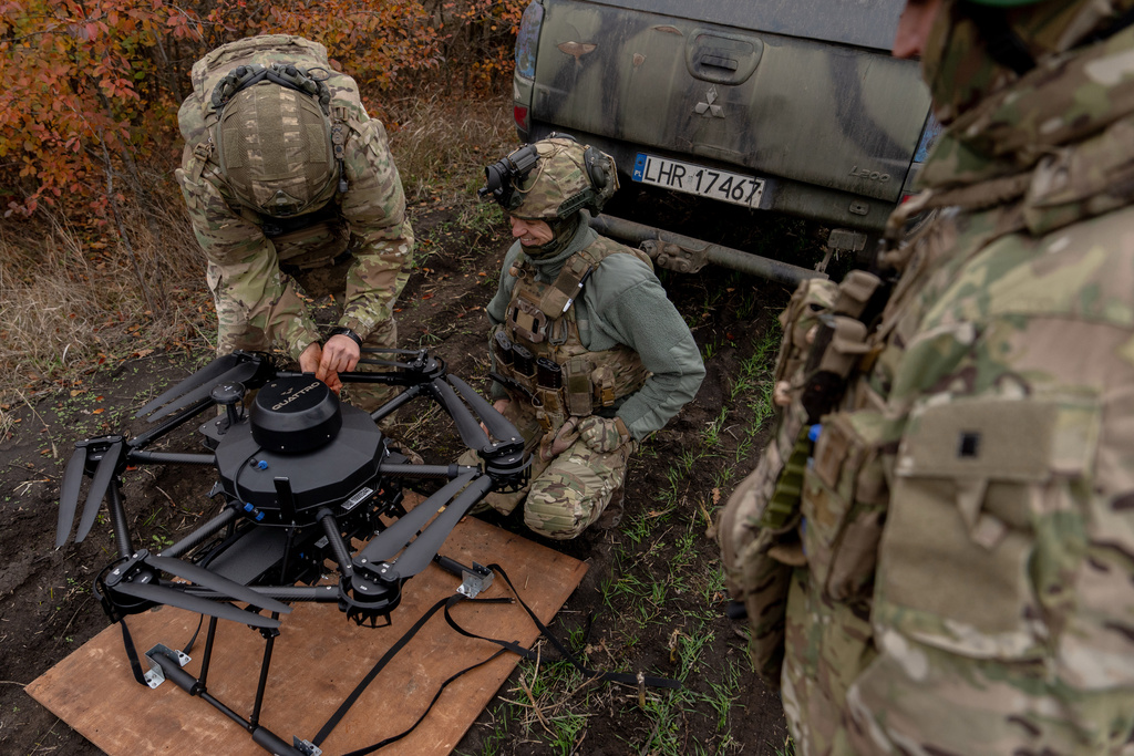 Ukrainian soldiers with the Kraken 1654 unit prepare a Vampire drone before a demonstration for The Associated Press, Wednesday, Nov. 5, 2025, in Kharkiv Oblast, Ukraine. Source: AP Photo.